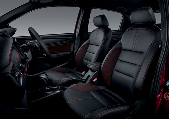 LEATHER^ AND FABRIC SEATS WITH RED STITCHINGS